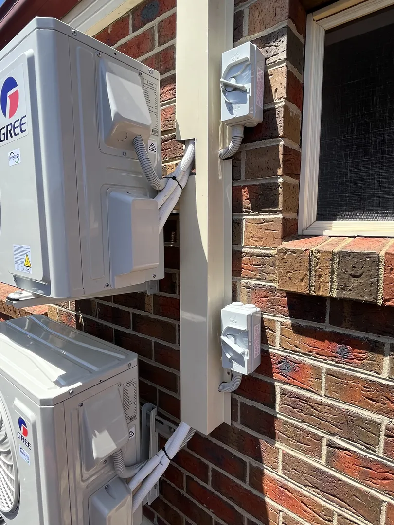 Outdoor condenser installation detail with pipework concealed in neat trunking